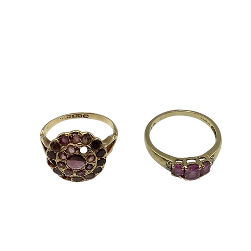 14 - A 15ct gold and garnet set dress ring(two vacant settings) together with a 9ct gold gem set three st... 