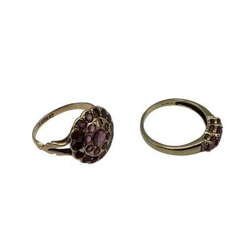 14 - A 15ct gold and garnet set dress ring(two vacant settings) together with a 9ct gold gem set three st... 