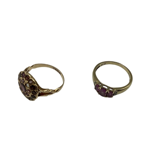 14 - A 15ct gold and garnet set dress ring(two vacant settings) together with a 9ct gold gem set three st... 