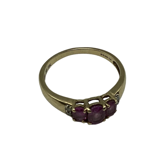 14 - A 15ct gold and garnet set dress ring(two vacant settings) together with a 9ct gold gem set three st... 