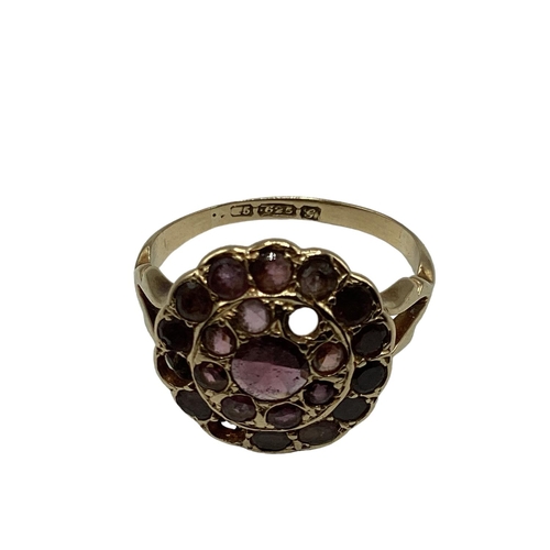 14 - A 15ct gold and garnet set dress ring(two vacant settings) together with a 9ct gold gem set three st... 