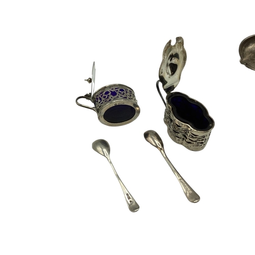 20 - Collection of sterling silver items to include pepperettes, urn shaped salts, mustards, coin set ash... 