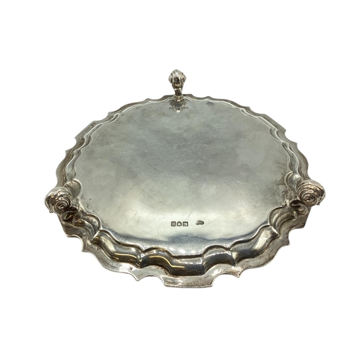 22 - Sterling silver circular card tray raised on three shell feet by Goldsmith and Silversmith company L... 