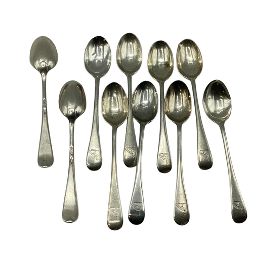 24 - A collection of sterling silver items to include egg cup, caddy spoon, tea spoons, a spoon and fork ... 