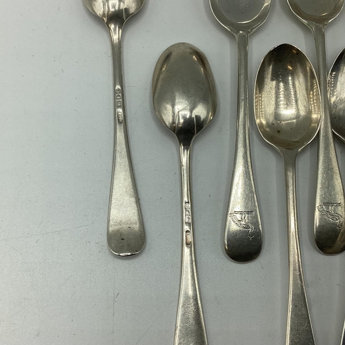 24 - A collection of sterling silver items to include egg cup, caddy spoon, tea spoons, a spoon and fork ... 