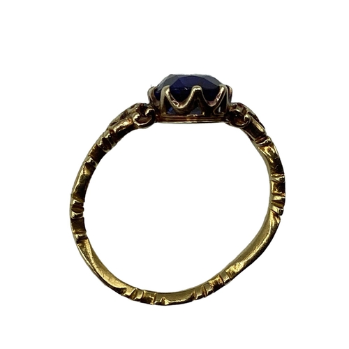 26 - An 18th Century and later unmarked yellow metal mourning ring, with later added central oval free cu... 