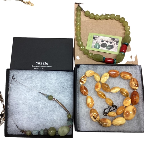 28 - A collection of costume and bead jewellery To include tigers eye with silver flower pendant, malachi... 