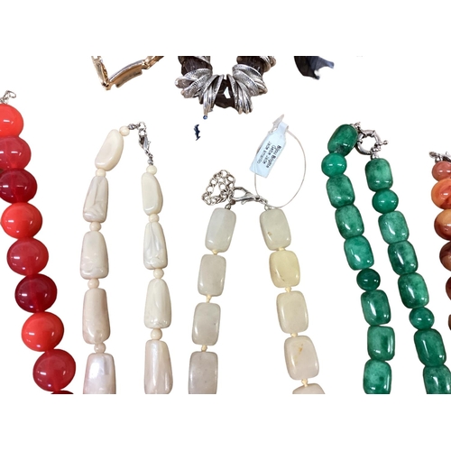 28 - A collection of costume and bead jewellery To include tigers eye with silver flower pendant, malachi... 