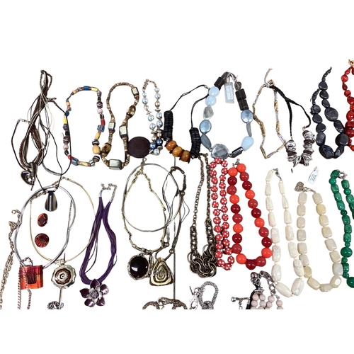 28 - A collection of costume and bead jewellery To include tigers eye with silver flower pendant, malachi... 