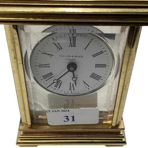 31 - A sterling silver panelled electric carriage clock. Gilt metal case with three sterling silver panel... 