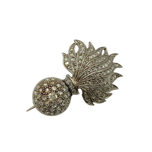 4 - An unmarked yellow metal artillery sweethearts brooch set throughout, with rose and single cut diamo... 