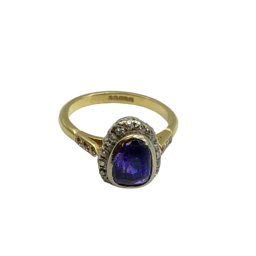 5 - An 18ct gold and unmarked white metal sapphire and diamond ring, central pair shaped free cut sapphi... 