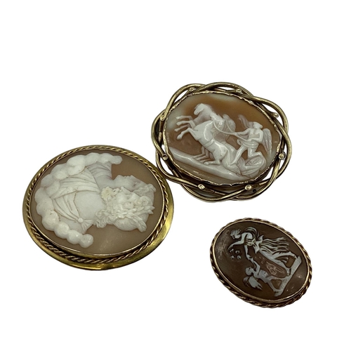 6 - Three unmarked yellow metal mounted shell cameo broaches  depicting classical scenes, largest 6cm x ... 