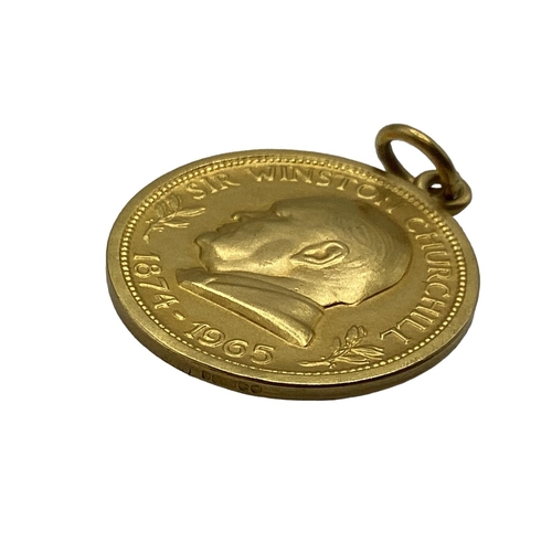 9 - A 9ct gold Sir Winston Churchill commemorative coin pendant, 1874 - 1965 with 'We shall fight on the... 