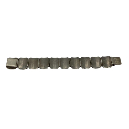 92 - A South East Asian white metal panel bracelet marked Siam.