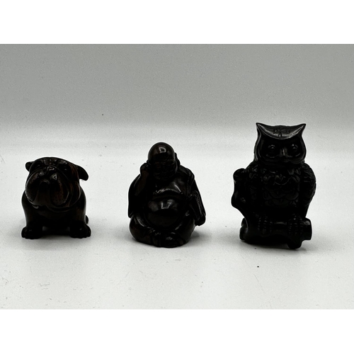 115 - Three fruitwood carved Japanese Netsuke.