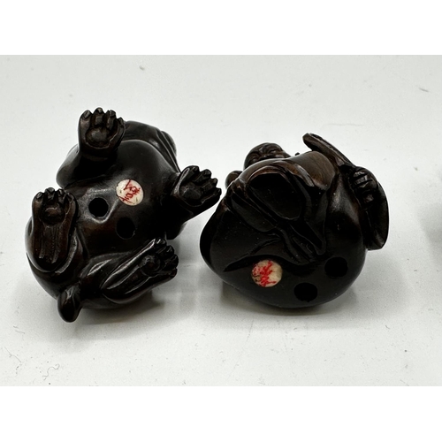 115 - Three fruitwood carved Japanese Netsuke.