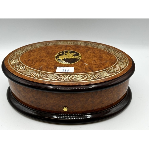 116 - A Sorrento ware style oval lidded music box.