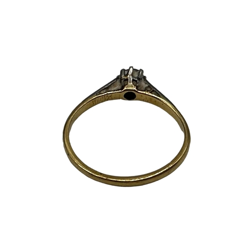 56 - An 18ct gold and platinum single stone diamond ring. Single brilliant cut diamond in an eight claw s... 