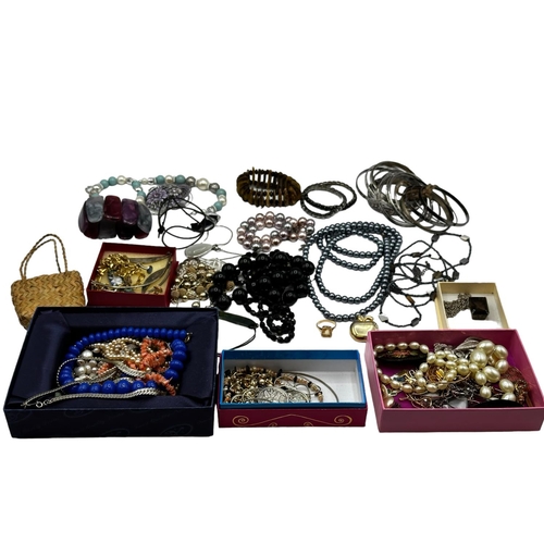 60 - A collection of costume and bead jewellery, white metal bangles etc.