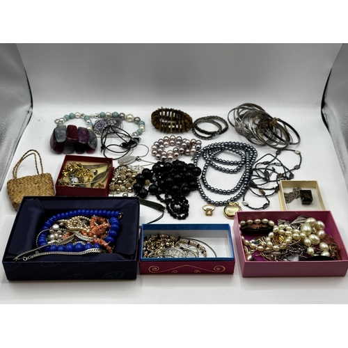 60 - A collection of costume and bead jewellery, white metal bangles etc.