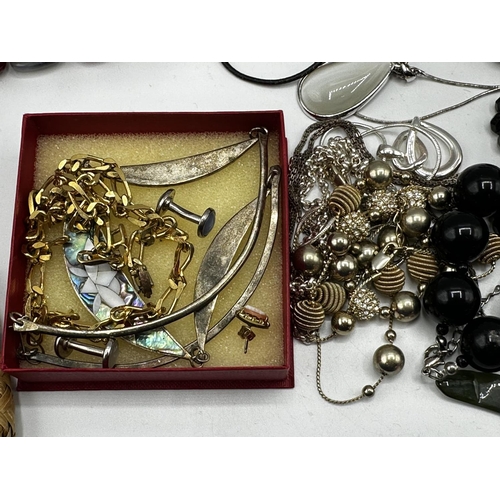 60 - A collection of costume and bead jewellery, white metal bangles etc.