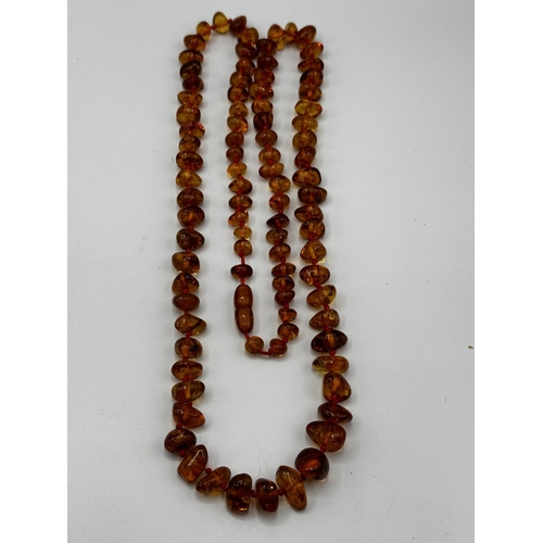 62 - A Honey Amber large beads necklace (later clasp)  and a collection of hardstone jewellery, to includ... 