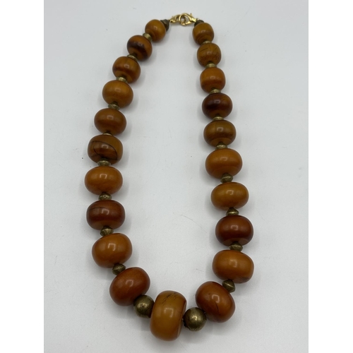 62 - A Honey Amber large beads necklace (later clasp)  and a collection of hardstone jewellery, to includ... 