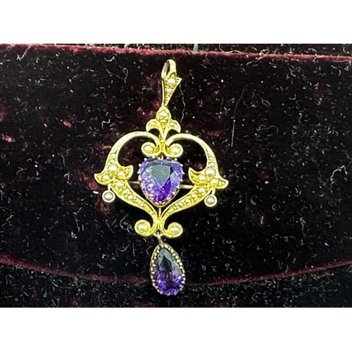 90 - A 15ct gold amethyst and split pearl art nouveau style pendant. 2.01g. In original box without chain... 