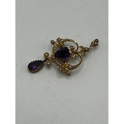 90 - A 15ct gold amethyst and split pearl art nouveau style pendant. 2.01g. In original box without chain... 