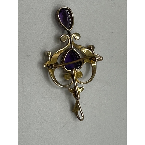 90 - A 15ct gold amethyst and split pearl art nouveau style pendant. 2.01g. In original box without chain... 