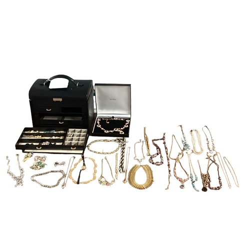 11 - Large collection of costume jewellery, contained within a good quality leather jewellery box