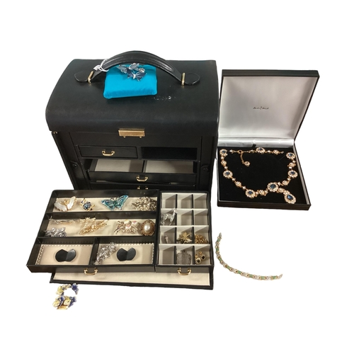 11 - Large collection of costume jewellery, contained within a good quality leather jewellery box