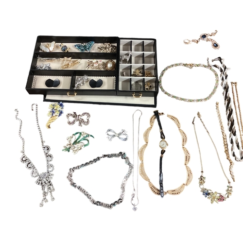 11 - Large collection of costume jewellery, contained within a good quality leather jewellery box