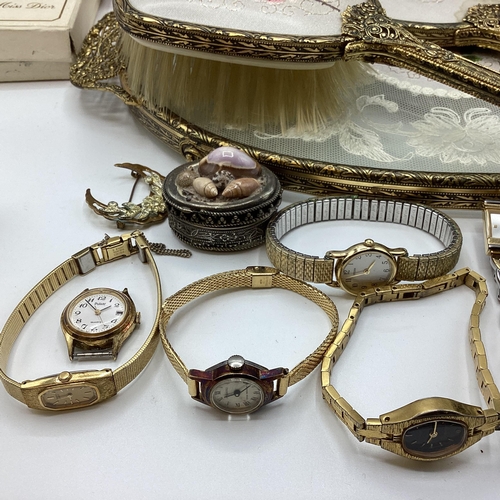 50 - A collection of costume jewellery and fashion watches etc.