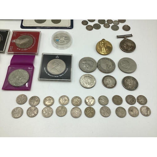 52 - A collection of coins, sixpences etc together with two WWI medals to PTE AG Jones ASG.