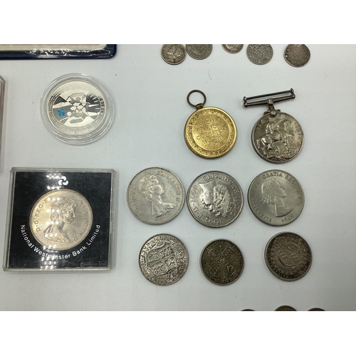 52 - A collection of coins, sixpences etc together with two WWI medals to PTE AG Jones ASG.