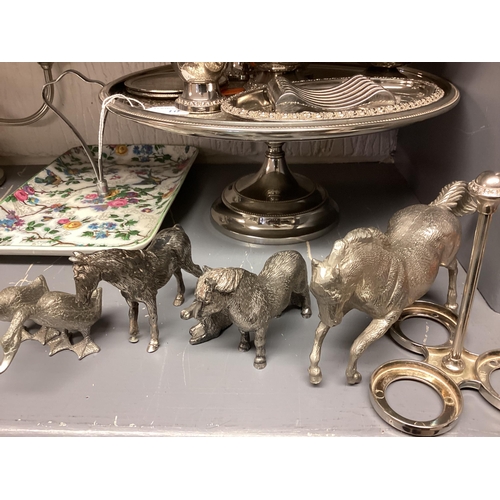 10 - A collection of silver plated wares to include candelabra, Taza, model horses etc