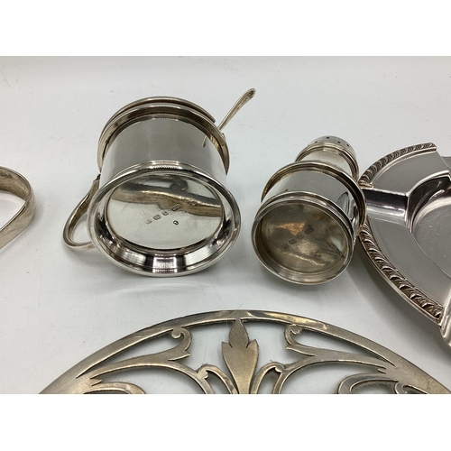 101 - A collection of sterling silver items to include an ashtray and teapot stand, gross weight 560 g