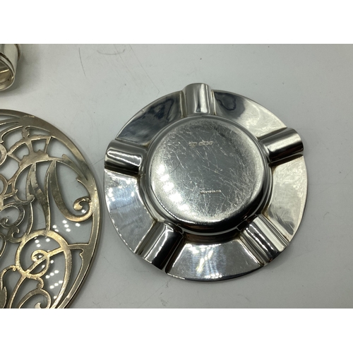 101 - A collection of sterling silver items to include an ashtray and teapot stand, gross weight 560 g