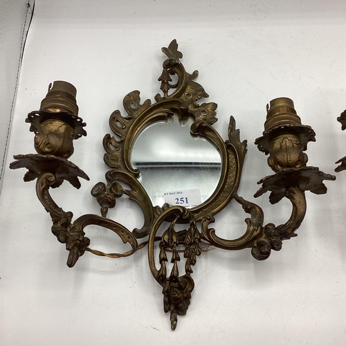 251 - A pair of early C20th wall sconces with oval mirrors and foliate decoration, approx 31cm High overal... 