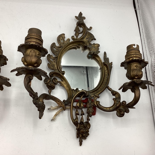 251 - A pair of early C20th wall sconces with oval mirrors and foliate decoration, approx 31cm High overal... 