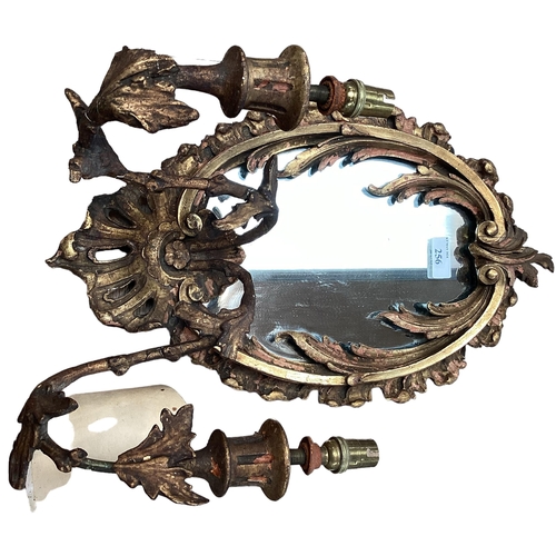 256 - A pair of oval sconces, with mirrored back and ornate floral carved gesso surround, 39cm High overal... 