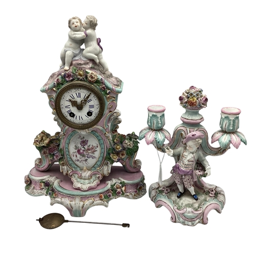 261 - A Meissen clock on stand, and a two branch candleholder, 22cmH,