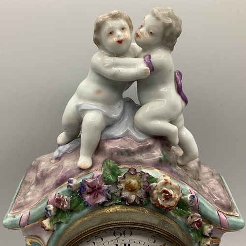 261 - A Meissen clock on stand, and a two branch candleholder, 22cmH,