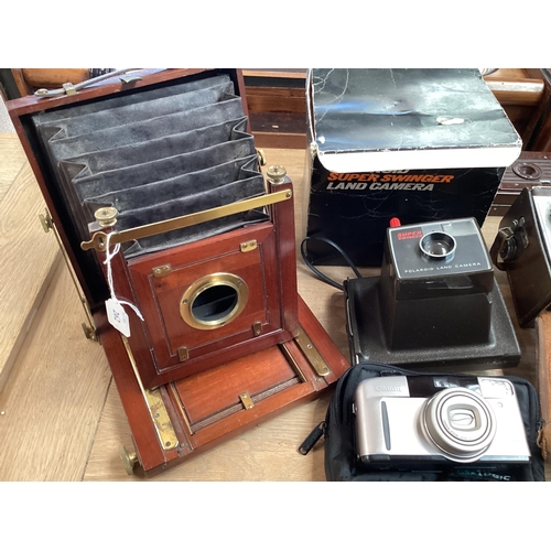 262 - A quantity of vintage cameras including a Marion & Co, 22 & 23 Soho Square, London W, see images