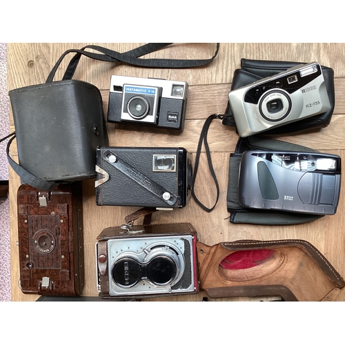 262 - A quantity of vintage cameras including a Marion & Co, 22 & 23 Soho Square, London W, see images