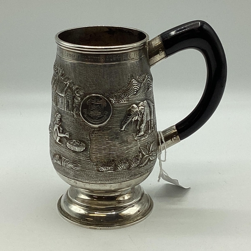 62 - A South Asian white metal mug with country scenes and elephants. Engraved from 'The Calcutta Lodge'.... 