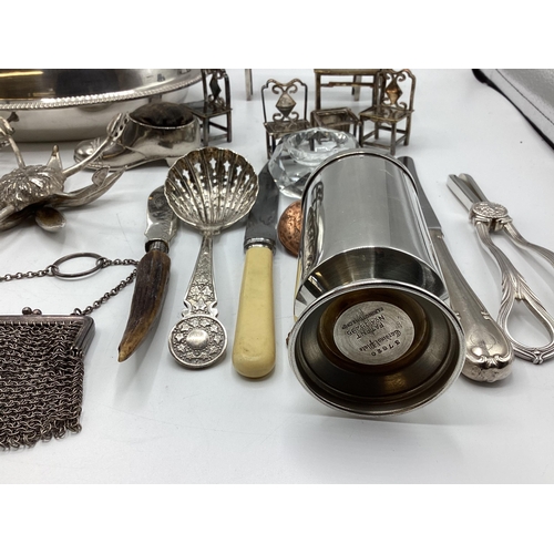 85 - A collection of unmarked white metal items to include wick scissors, dolls house furniture and other... 