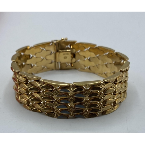 142 - An 18ct gold buckle bracelet, 49g